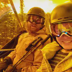 Alex and Mariah taking a selfie inside the Orange Bubble of the Tee Pee Town Luxury Express Quad at Sunshine Village