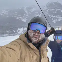 Alex and Mariah demonstrating the views from the edge of the new terrain at Grand Targhee