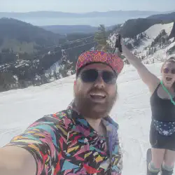 Alex and Mariah skiing in July at the top of the mountain