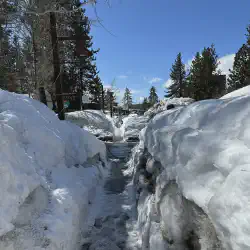 6ft tall snow berms surrounding the side walk in Tahoe City